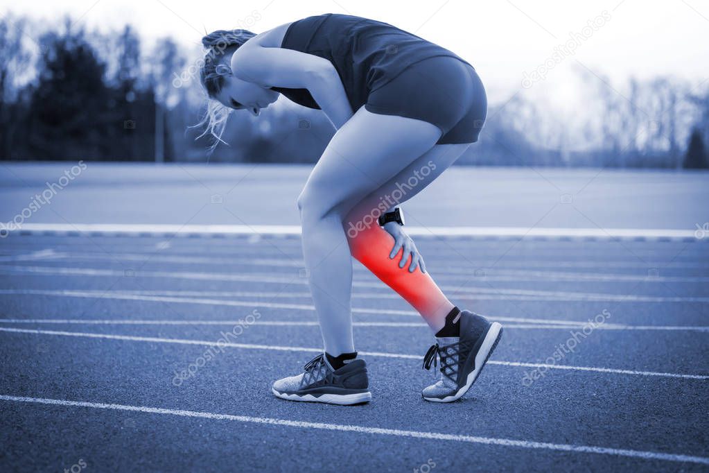 Athlete woman with calf cramp, pain in leg during running