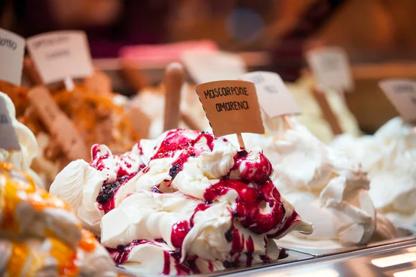 Ice cream in showcase fridge at confectionery shop