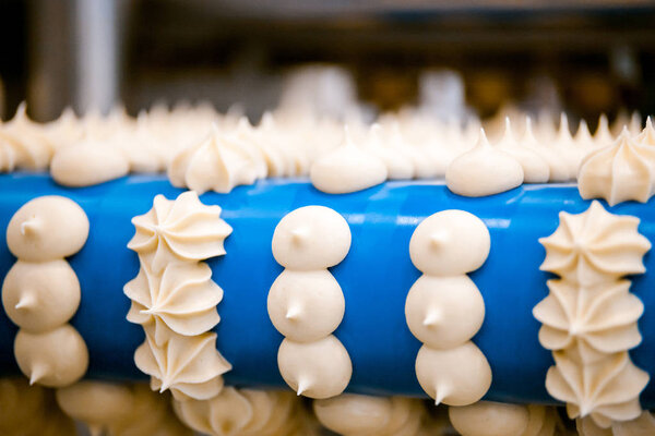 production line conveyor making meringues in confectionery factory