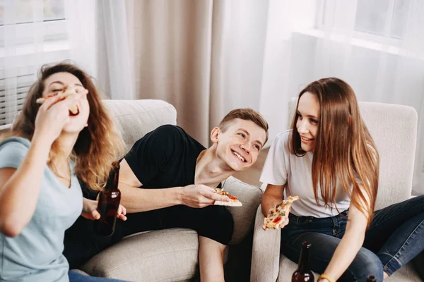 friends chatting flirting sharing pizza at table