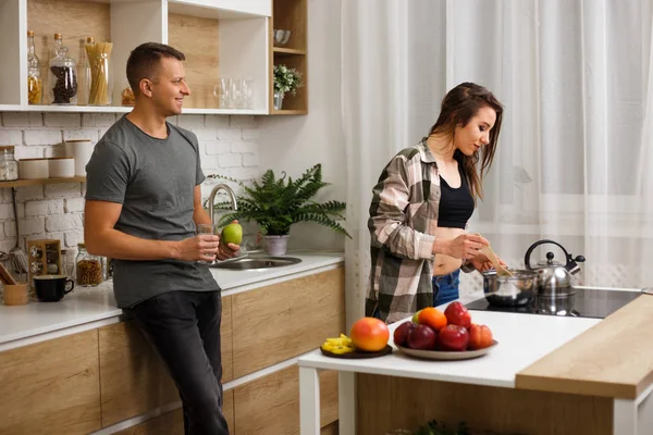 fit couple having breakfast at home kitchen