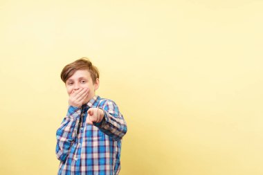 boy mocking and laughing pointing finger at viewer clipart
