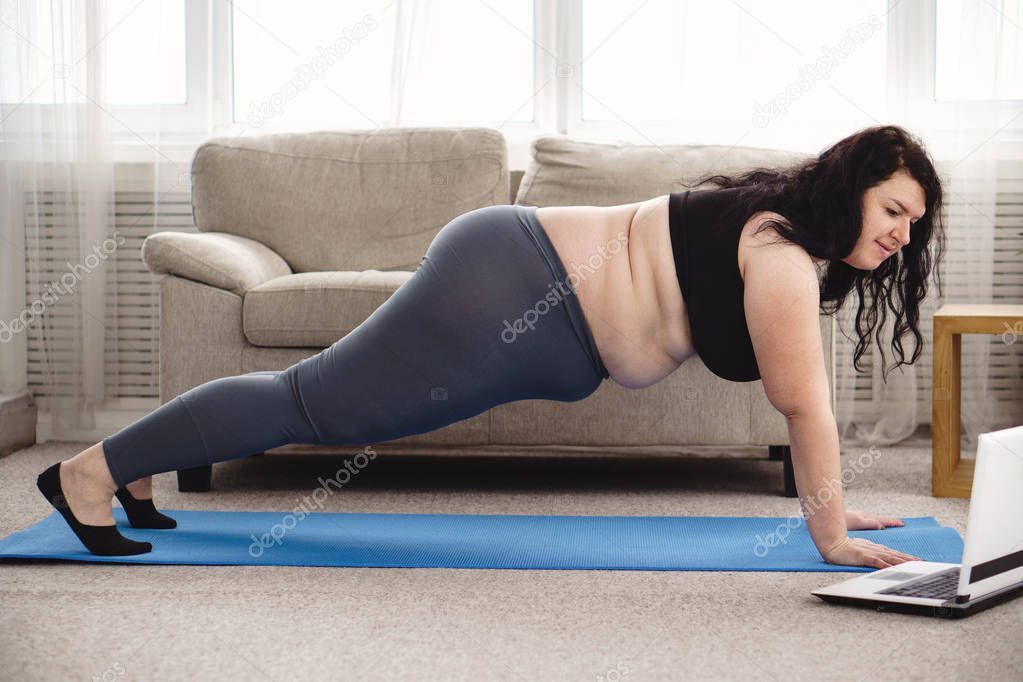 obese woman working out with online personal couch