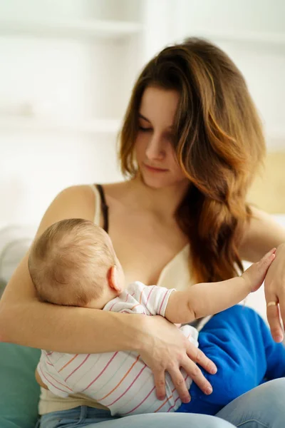 Young mother breastfeeding her little son — Stock Photo, Image