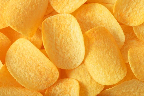 Högen Gula Krispiga Potatis Chips Bakgrund Eller Konsistens — Stockfoto