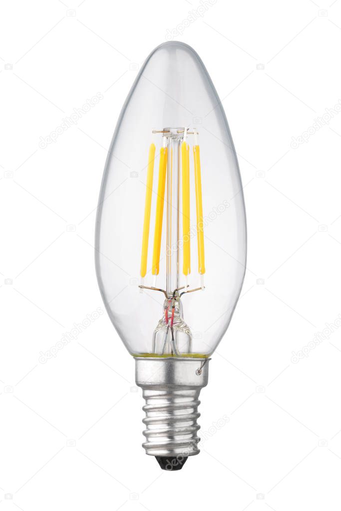 Candle transparent LED filament bulb with brass light socket isolated on white background