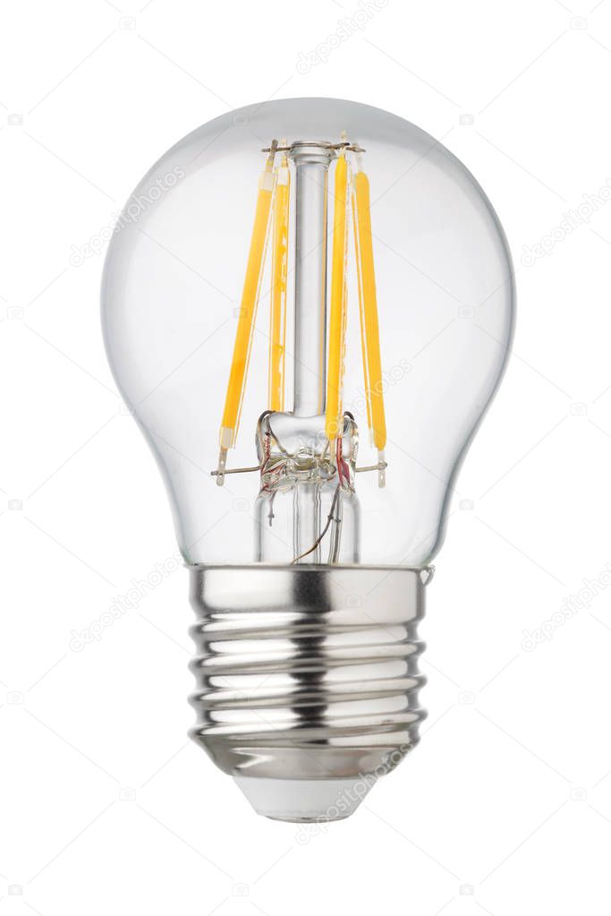 Modern transparent LED filament bulb with brass light socket isolated on white background