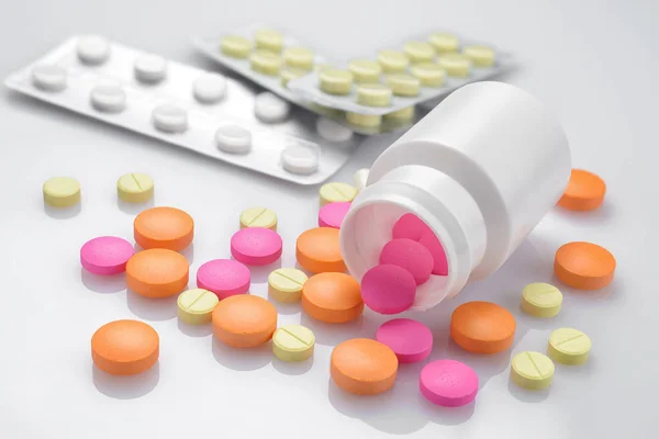 Plastic Bottle Heap Different Colored Pills White Table Macro Shot — Stock Photo, Image