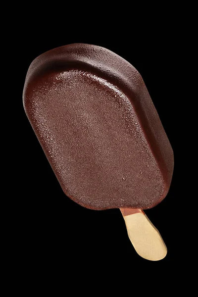 Chocolate popsicle on black background — Stock Photo, Image