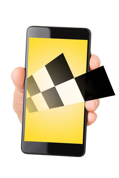 Hand holding smartphone met taxi symbool — Stockfoto