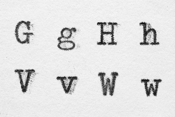 Real typewriter font alphabet with letters G, H, V, W — Stock Photo, Image