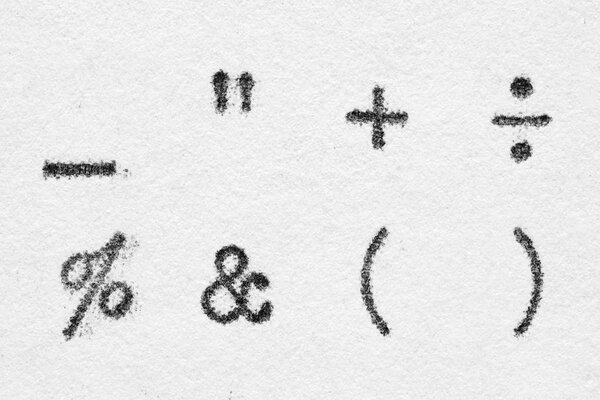 Real typewriter symbols on white paper