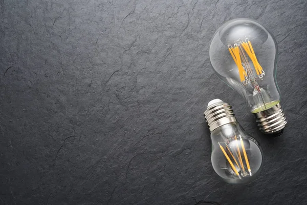 Transparent LED filament light bulbs on black background — Stock Image Transparent LED filament light bulbs on black background Royalty Free Stock Photos