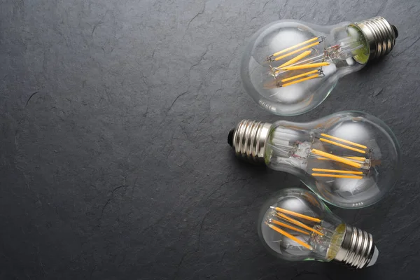 Transparent LED filament light bulbs on black background. — Stock Image Transparent LED filament light bulbs on black background. Stock Image
