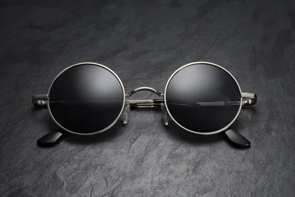 Classic Gray Gun Metal Sunglasses Black Slate Background — Stock Photo, Image