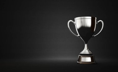 koyu arka plan üzerinde gümüş kazanan cup 