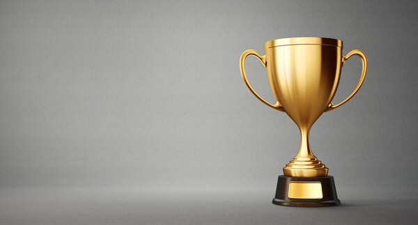 golden winner cup on grey background 