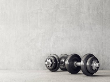 İki dambıl gri arka plan üzerinde siyah