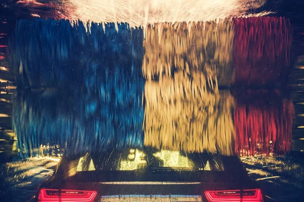 Colorful Car Wash Action Modern Vehicle Spinning Washing Brushes — Stock Photo, Image