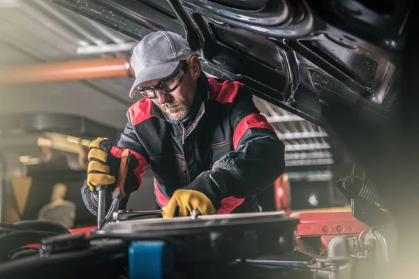 Automotive Pro Mechanic Trying to Fix Old Gasoline Engine.