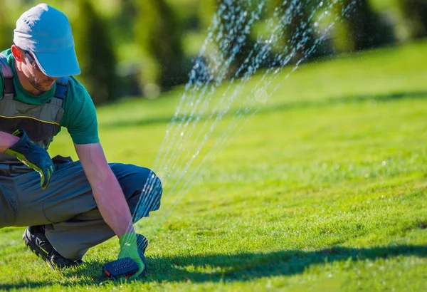 Lawn Sprinkler Installation Professional Technician Gardening Landscaping Theme — Stock Photo, Image