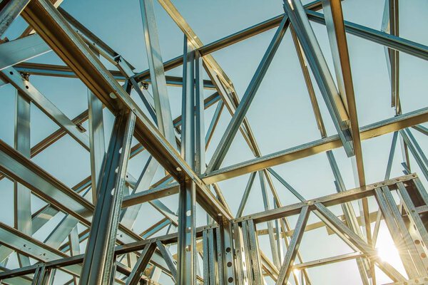 Building Steel Skeleton Frame at Sunset. Modern Building Structure Technologies.