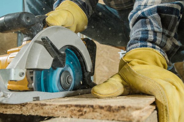 Circular Saw Woodwork Job. Construction Equipment in Action. Closeup Photo.