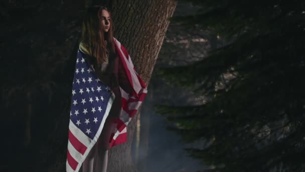 School Age Girl Standing Trees Big American Flag Wrapped Shoulders — Vídeo de Stock
