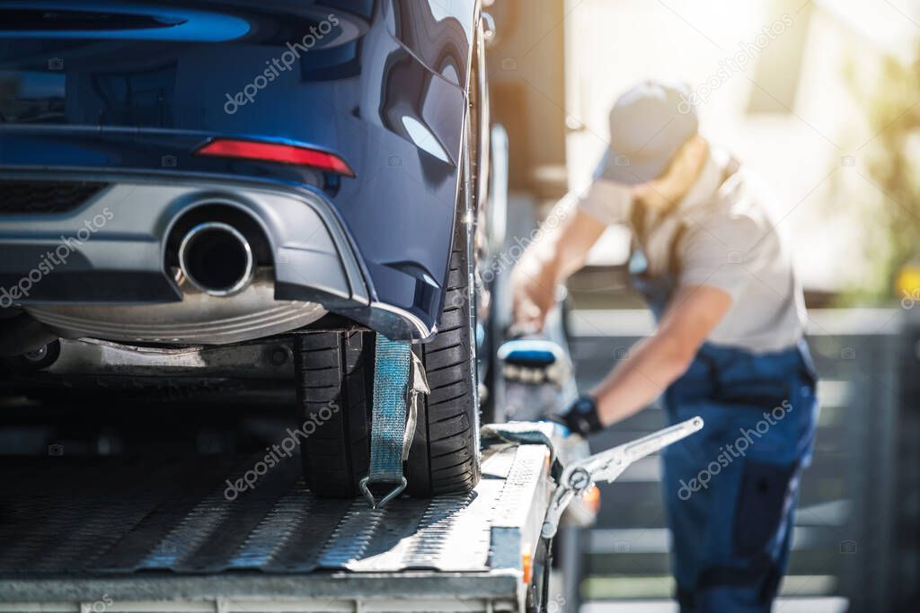 Towing Truck Delivery. Shipping Modern Vehicle to Car Dealership From Auction Lot. Transportation and Cargo Theme.