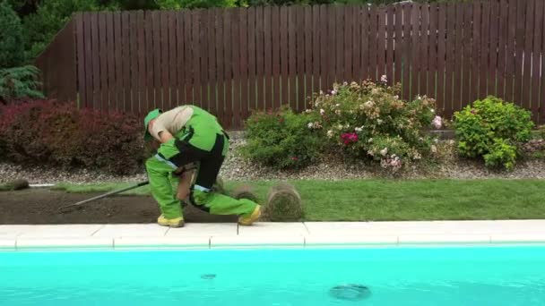 Male Worker Raking Soil Leveling Ground Swimming Pool Area Lay — Stock Video