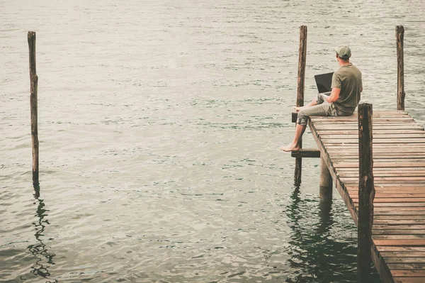 Caucasian Men Laptop Computer Remotely Working Wooden Deck Enjoying Lake — Stock Photo, Image