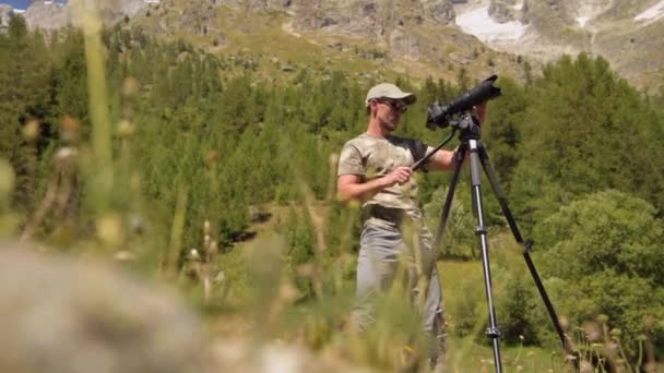 Caucasian Photographer Preparing Photo Equipment Outdoor Pictures — Stock Video