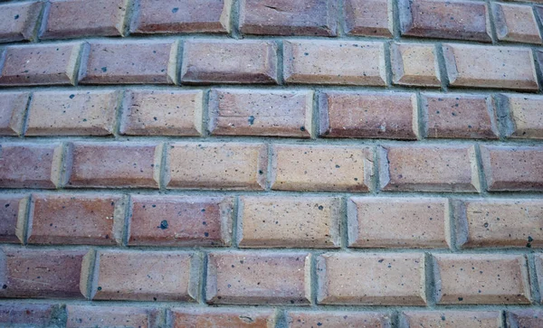 Bricks wall background. Bricks horizontal lines. Red and yellow bricks in the wall. Close up of wall with small blocks