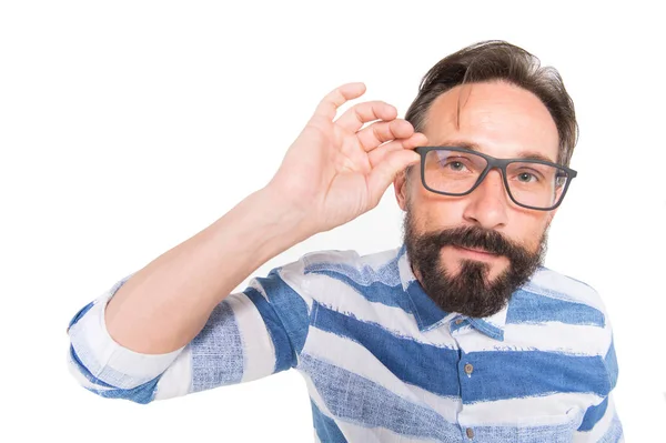 Hipster in glasses on white background. Fish-eye portrait of bearded guy in glasses. Surprised poindexter on white. Nerd guy in blue lines t-shirt and big glasses