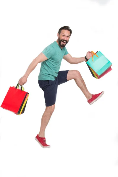 Ενθουσιασμένοι Νέους Shopaholic Μεταφέρουν Αγορών Του Και Χαμογελώντας Ευτυχώς Ενώ — Φωτογραφία Αρχείου