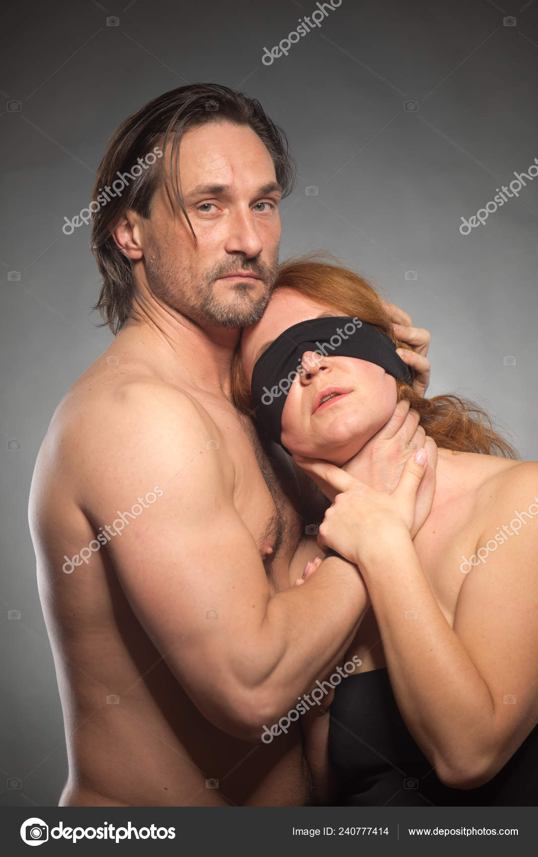 Waist Image Strict Shirtless Man Keeping His Blindfolded Sensual Wife Stock Photo by ©ReyRomMedia 240777414 photo