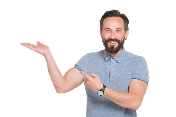 Delighted bearded man keeping his palm up and pointing aside — Stock Photo, Image