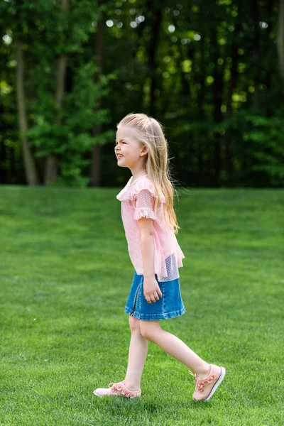 Side View Adorable Little Child Walking Grass Park — Free Stock Photo