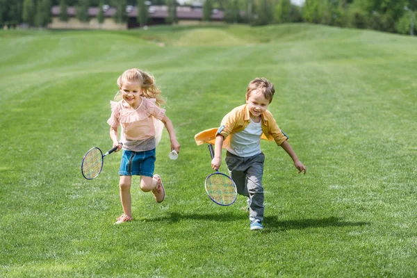 Cute Smiling Children Badminton Rackets Running Together Park — Stock Photo, Image