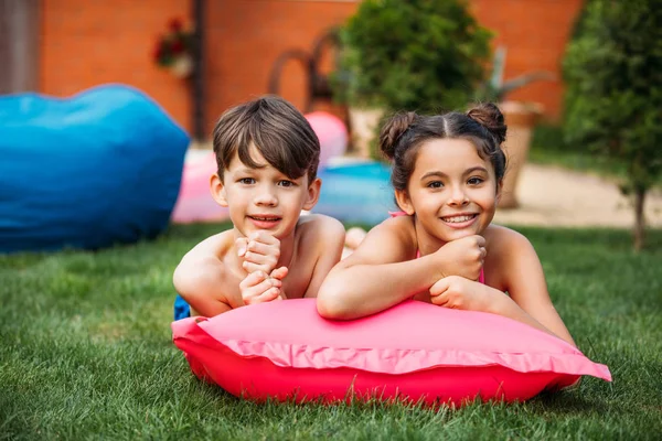 Portrait Cute Kids Resting Inflatable Mattress Green Lawn Backyard Country — Stock Photo, Image