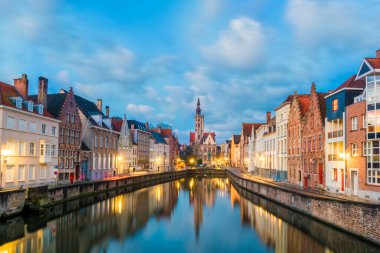 Spiegelrei canal and Jan Van Eyck Square in the morning in Bruges, Belgium clipart
