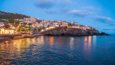 Harbor and fishing village Camara de Lobos at twilight time, Madeira island, Portugal clipart
