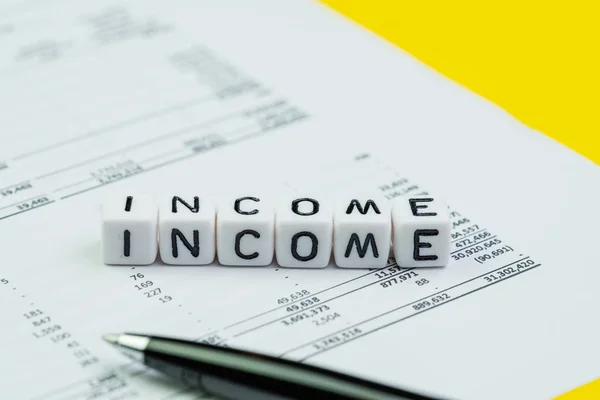 Income, company revenue or profit and loss report concept, cube — Stock Photo, Image