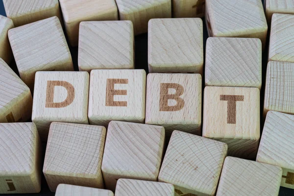 Dívida, dinheiro no futuro que você emprestar ou emprestar conceito, cubo — Fotografia de Stock