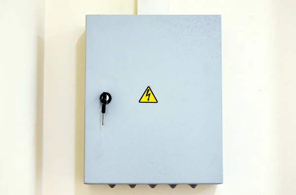 Electric box with a sign of attention. Private key.