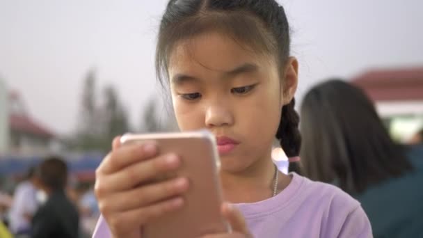 Little Girls Outdoor Sunset Uses Smartphone — Stock Video