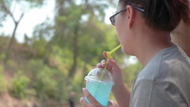 Appy Asian Woman Drinking Blue Soda Public Park — Stock Video