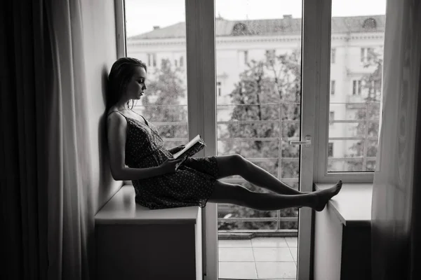 Pensive Dreamy Female Holding Book Home Looking Big Window Dreaming — Stock Photo, Image