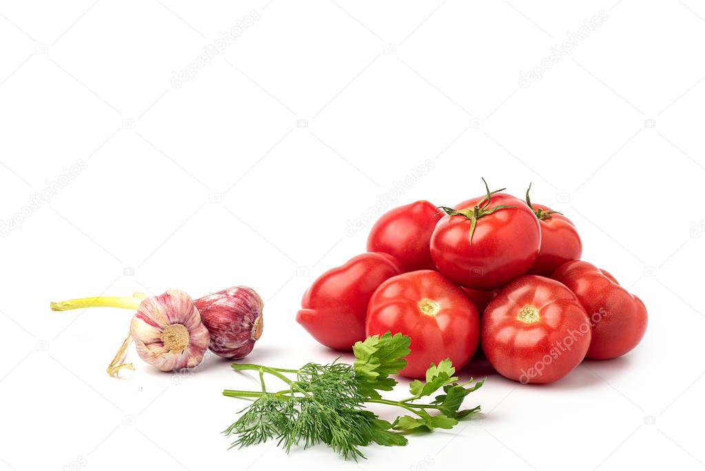 Still life, juicy, red, ripe tomatoes,with garlic,on a white background