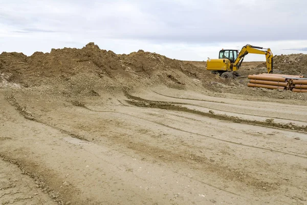 Excavadora Una Obra Construcción Arcillosa —  Fotos de Stock